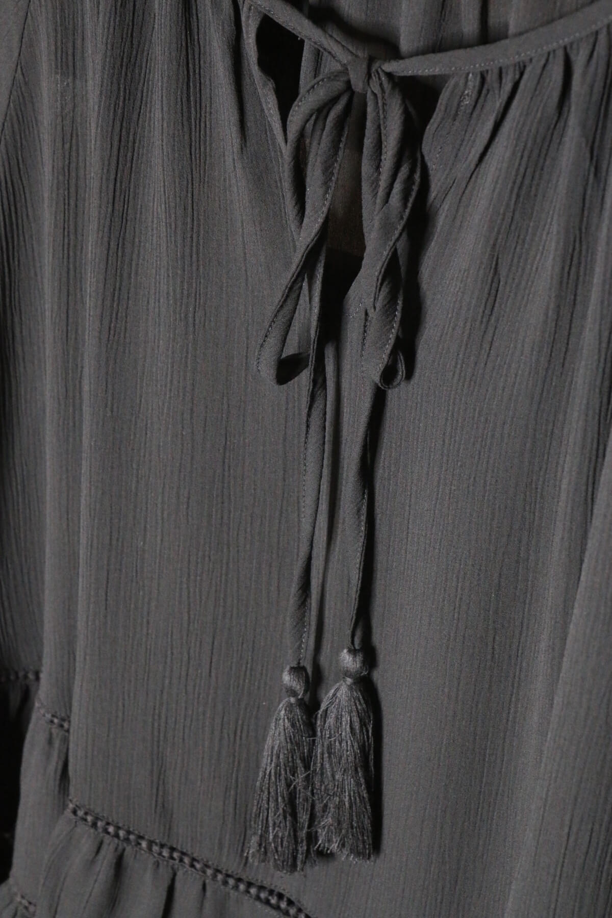 Black Tiered Ruffled Blouse with Tassels and Crochet details.