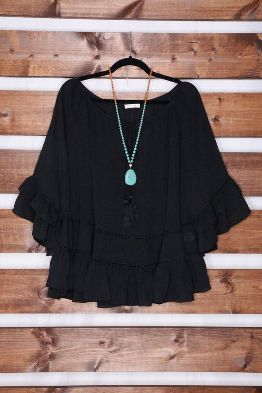 Black Tiered Ruffled Blouse with Tassels and Crochet details.