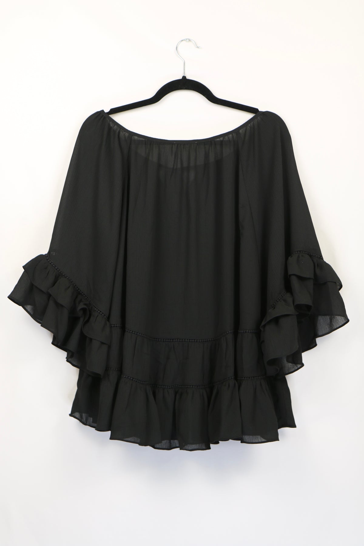 Black Tiered Ruffled Blouse with Tassels and Crochet details.