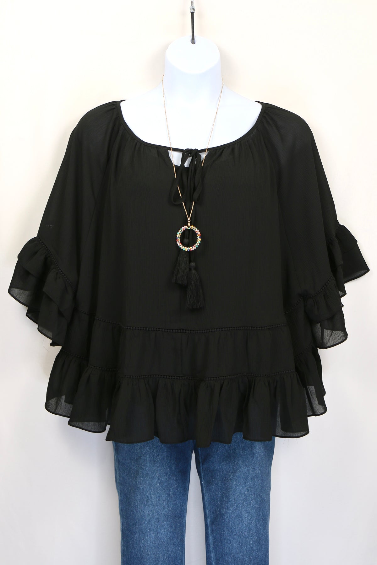 Black Tiered Ruffled Blouse with Tassels and Crochet details.