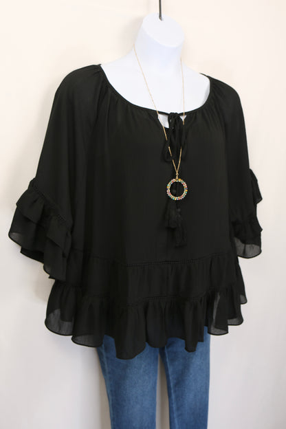 Black Tiered Ruffled Blouse with Tassels and Crochet details.