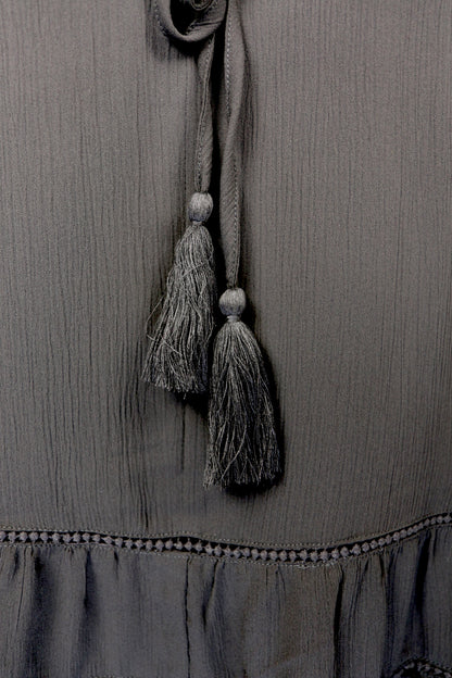 Black Tiered Ruffled Blouse with Tassels and Crochet details.