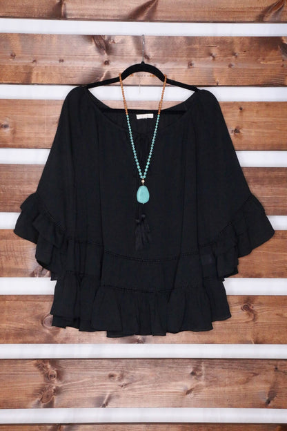 Black Tiered Ruffled Blouse with Tassels and Crochet details.
